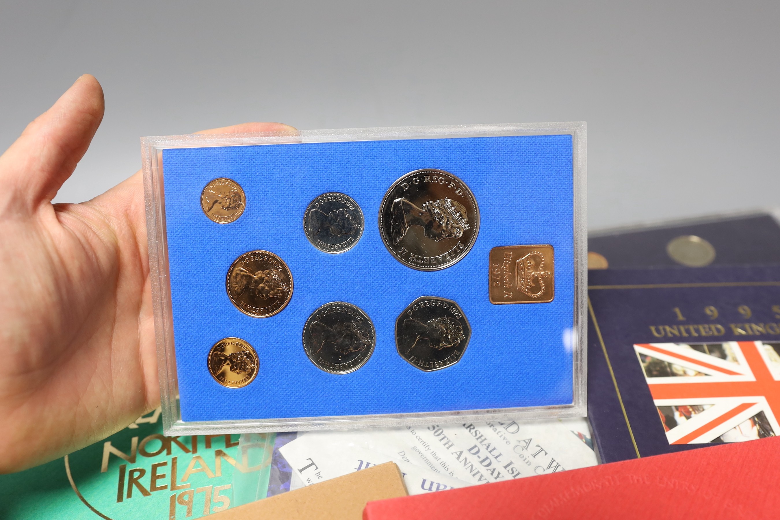 A group of UK Royal Mint BU year sets.